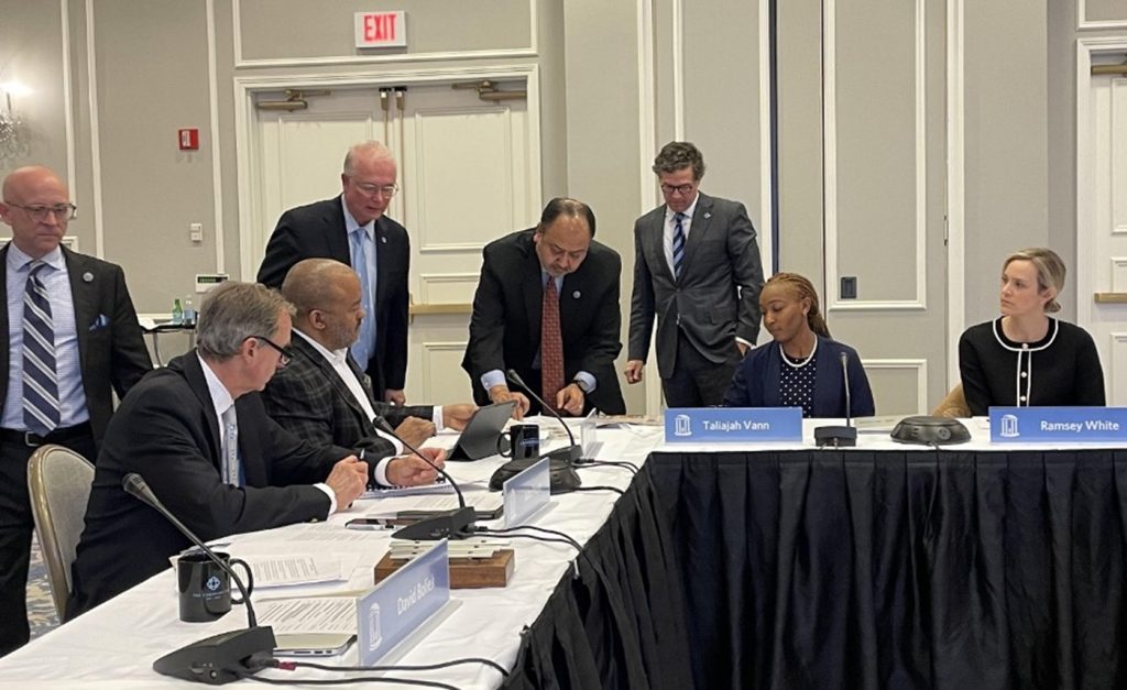 Photo of Trustees at the conference table with beige and white background signing pledge at the January 23, 2023 Board Meeting.